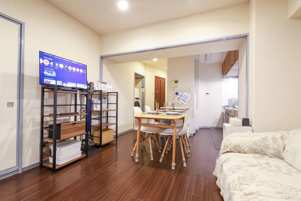 Open-plan living and dining area at Gotanda Riverside Inn